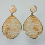 A pair of 18 carat gold mounted fossilised stone set pendant earrings, 7cm drop, 21.