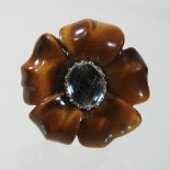 A large 18 carat gold, carved tigers eye and aquamarine ring, in the form of a flower head,