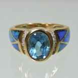 An 18 carat gold blue topaz and diamond ring,