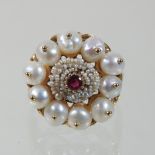 An unmarked ruby, seed pearl and pearl cluster ring, on a rope twist setting, 2cm diameter, size P,