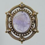 *Withdrawn* A 19th century Etruscan revival carved amethyst coloured, seed pearl and gilt brooch,