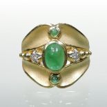 A modern 18 carat gold cabochon emerald and diamond ring, with a textured matt finish, size N, 8.