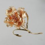 A 14 carat gold and ruby set brooch, in the form of a peony, with a pin back (stone missing),