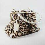 An Yves Saint Laurent cream leather and fur tote bag, bearing a label rive gauche,