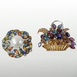 An 18 carat gold multi gem set brooch, of flower head design, set with a central pearl,