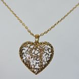 A Boucheron 18 carat gold heart shaped pendant, inset with the letter B, set with a single diamond,