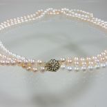 A three row two colour pearl bead necklace,