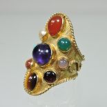 A modern 18 carat gold ring, set with a collection of nine specimen polished stones, size M, 3.