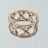 A Dior 18 carat gold band, of openwork design, with rope twist and reeded decoration,