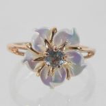 A 14 carat rose gold aquamarine and carved mother of pearl ring, of flower head design,