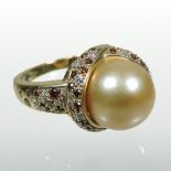 A Mauboussin 18 carat gold and golden pearl ring,