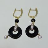 A pair of 18 carat gold, diamond and carved black onyx drop earrings, 3cm drop, 4.