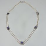 A fine 14 carat gold cabochon sapphire and diamond necklace, with a filigree clasp, 18cm drop,