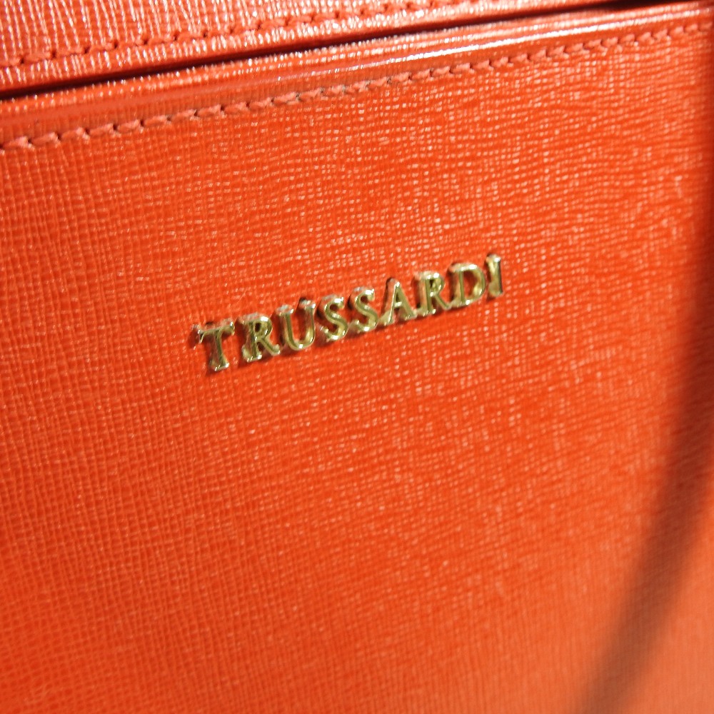 A Trussardi red leather handbag, decorated with buckles, - Image 3 of 6