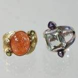 A modern unmarked sunstone cabochon and peridot ring, size M,