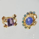 An unmarked cabochon dress ring, of oval asymmetrical shape, 3cm high, size O,