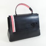An Emilio Pucci black leather handbag, with pink stripe and raised monogram,