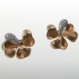 A pair of 18 carat gold and diamond set earrings, each in the form of a shamrock,