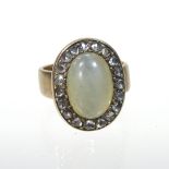 An unmarked jade coloured cabochon and diamond ring, size I, 9.