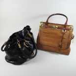 A Michael Kors light brown crocodile skin handbag, together with a Michael Kors dark brown handbag,