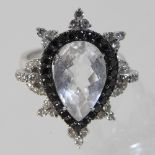 An 18 carat gold clear quartz, diamond and black diamond cluster ring,