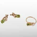 A 14 carat rose gold and peridot ring, of asymmetrical scrolled design, size M,