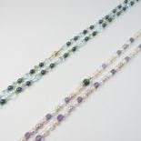 A JKa single strand cultured pearl and purple coloured bead necklace, with an 18 carat gold clasp,