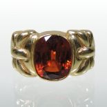 *Withdrawn* A 14 carat gold red topaz single stone collet set ring,