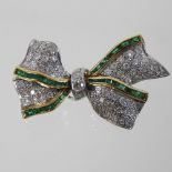 An 18 carat gold, diamond and emerald articulated brooch, in the form of a tied bow, 4cm wide, 12.