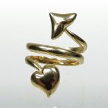 A Dior 18 carat gold ring, in the form of a heart and arrow, numbered B7271, size K, 9.