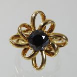 An unmarked smoky quartz ring, of twisted flower head design, 2.5cm diameter, size P, 10.