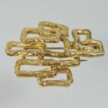 A Mauboussin, Paris, unmarked textured brooch, of geometric coiled design, with a pin back,