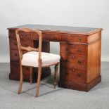 A Victorian mahogany pedestal desk, 126cm, together with a fruitwood chair,