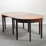 A George III style mahogany D end dining table, with two additional leaves,