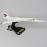 A scale model of Concorde by Bravo Delta Models, mounted on a stand,