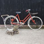 A red painted postman's bicycle,