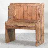 A rustic pine pew,