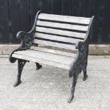 A slatted garden chair, with cast iron ends,