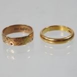 An 18 carat gold wedding band,