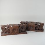 A pair of large Eastern carved wooden candle holders,