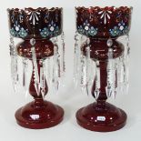A pair of 19th century glass table lustres, each with prism cut drops,