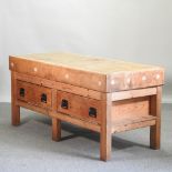 A beech butcher's block, on a pitch pine stand, containing two drawers,