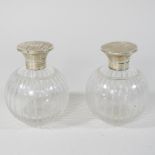 A pair of silver mounted etched glass scent bottles,