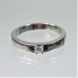 A platinum and diamond solitaire ring, 0.08 carats, size Q, 7.