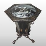 A 19th century tole painted coal bin, with a hinged verre eglomise lid,