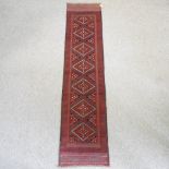 A Turkish woollen runner, with a row of seven medallions,