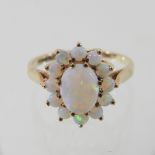 A 9 carat gold opal cluster ring, boxed,