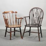 A 19th century elm seated wheel back arm chair,