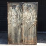 A mid 20th century industrial metal two door cabinet,