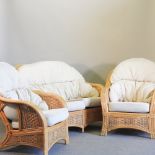 A bamboo conservatory suite, comprising a sofa, 135cm and a pair of armchairs,